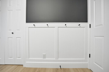 White wall with a blackboard on it