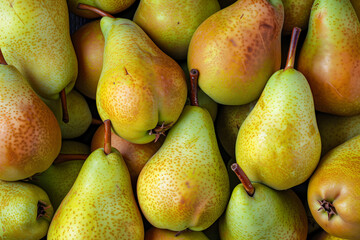 a pile of pears, arranged in an orderly manner, is captured from above. the background features vibrant yellow colors that highlight the texture and coloration of each pear. 