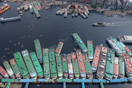 Aerial view of a bustling waterway crowded with an array of colorful boats and vessels, creating a vibrant tapestry of commerce and transport, Dhaka, Dhaka Division, Bangladesh.