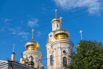Exploring the architecture of Saint Petersburg with golden domes under blue sky