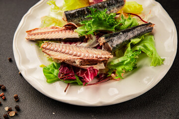 Mackerel salad canned fish, lettuce leaves tasty snack fresh delicious gourmet food table setting rustic food top view copy space keto and paleo diet vegetarian and vegan food pescetarian diet
