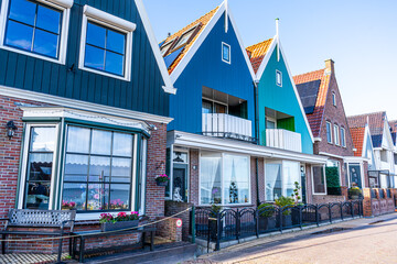 Obraz premium Volendam Netherlands classic Colorful houses on Volendam village embankment. Old Dutch architecture street Holland
