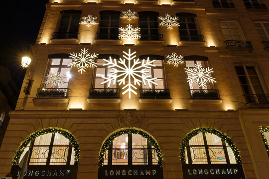 Paris, France - November 22, 2025 : View of facade of Longchamp Paris shop with christmas decoration. It is a Parisian fashion house founded in 1948, located at prestigious Saint Honore street in