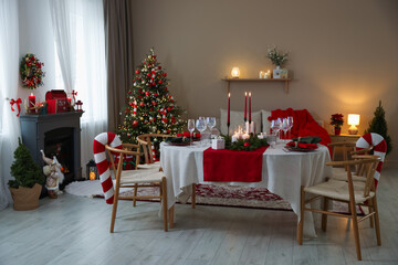 Festive table setting with Christmas decor indoors