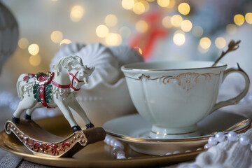 On the table there is New Year's tea 2026, coffee, gingerbread and pine cone cookies.