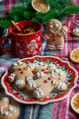 On the table there is New Year's tea 2026, coffee, gingerbread and pine cone cookies.