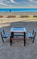 Table with a chessboard on a table on the shore of Lisa Beach, Santa Pola, Alicante, Spain