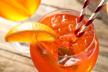 Refreshing spritzer cocktail on wooden table, closeup