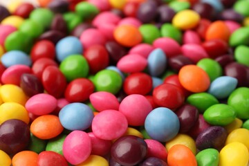 Many delicious colorful candies as background, closeup
