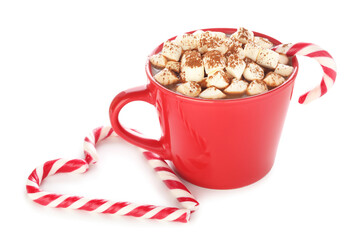 Tasty hot cocoa with marshmallows and candy canes isolated on white