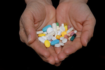 A woman who takes medication when she is sick. Excessive medication use negatively affects health.