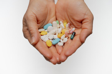 A woman who takes medication when she is sick. Excessive medication use negatively affects health.