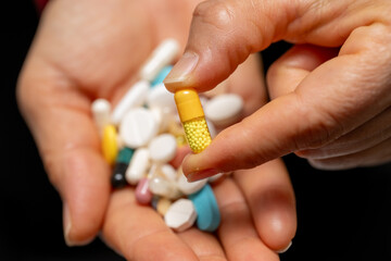 A woman who takes medication when she is sick. Excessive medication use negatively affects health.