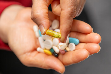 A woman who takes medication when she is sick. Excessive medication use negatively affects health.