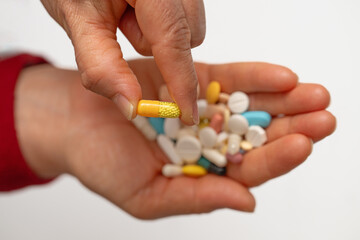 A woman who takes medication when she is sick. Excessive medication use negatively affects health.