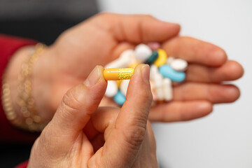 A woman who takes medication when she is sick. Excessive medication use negatively affects health.