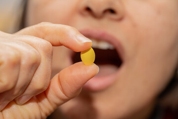 A woman who takes medication when she is sick. Excessive medication use negatively affects health.