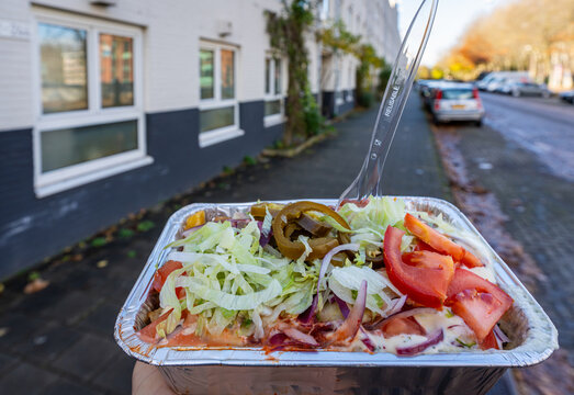 Dutch Kapsalon in takeaway tray, Popular Fast Food in the Netherlands