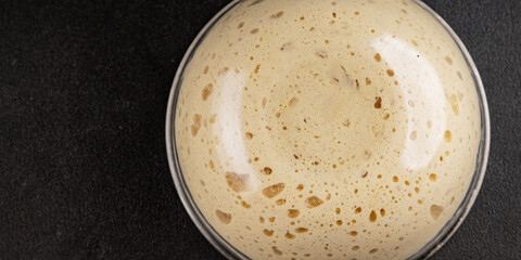 Raw dough yeast starter tasty snack fresh delicious gourmet food table background rustic food top view copy space
