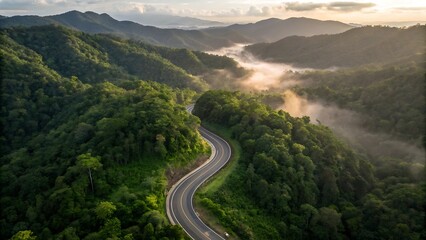 Aerial perspective of a winding asphalt highway cutting through dense emerald rainforest, dramatic serpentine curves climbing toward mist-covered highlands; lush tropical canopy, vibrant biodiversity,
