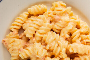 Carbonara pasta fusilli creamy sauce main course Italian cuisine tasty snack fresh delicious gourmet food background on table rustic food top view copy space