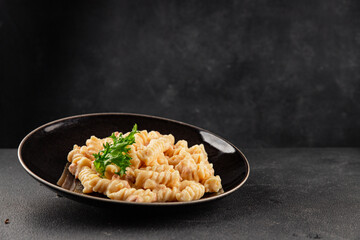 Carbonara pasta fusilli creamy sauce main course Italian cuisine tasty snack fresh delicious gourmet food background on table rustic food top view copy space