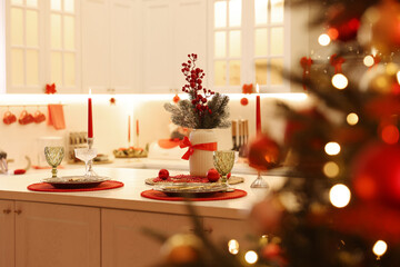 Christmas decor and tableware on countertop in kitchen. Interior design