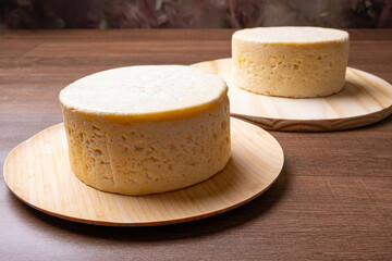 Semi-cured cheese, a wonderful semi-cured cheese from Minas Gerais on a rustic surface, selective focus.