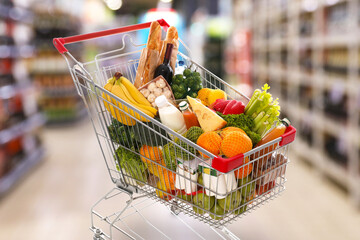 Shopping cart full of products in supermarket