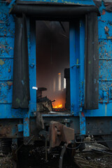 Reportage photo of a burning train car on the rails