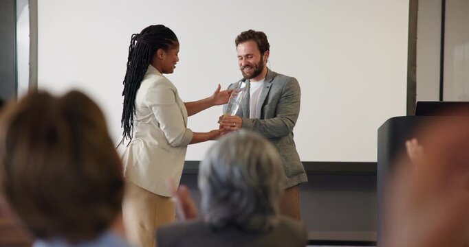 Business people, applause and handshake for award, celebration ceremony and smile at seminar. Clap, shaking hands or congratulations for achievement, success or giving trophy with conference audience