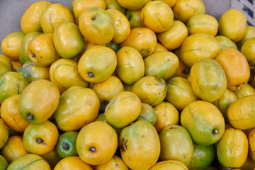Yellow plums for sale at market ciruela