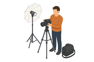 Male photographer setting up equipment for studio shoot with camera and tripod