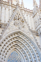 Catedral de Barcelona gothic cathedral pinnacle facade stone tracery light color medieval religious architecture ornate detail concept of travel tourism history