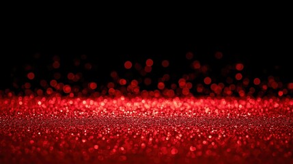 Intense, vibrant red glitter floor or surface sparkling brightly against a solid black background, creating a high-contrast, dramatic, and festive visual effect.