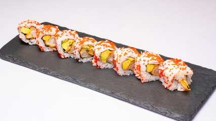 California rolls or uramaki, photographed on a white background, featuring sushi rice, avocado, cucumber, and crab, ideal for Japanese cuisine, food photography and restaurant menus. © vuk
