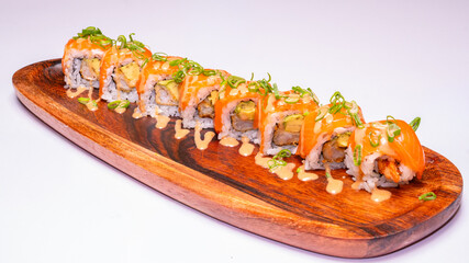 Serving of maki, traditional rolled sushi, photographed on a white background, perfect for Japanese cuisine menus, food photography, and restaurant promotions. © vuk