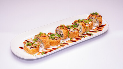 Plate of tempura sushi rolls, a popular type of cooked sushi, photographed on a white background, ideal for Japanese cuisine menus, food photography, and restaurant promotions.