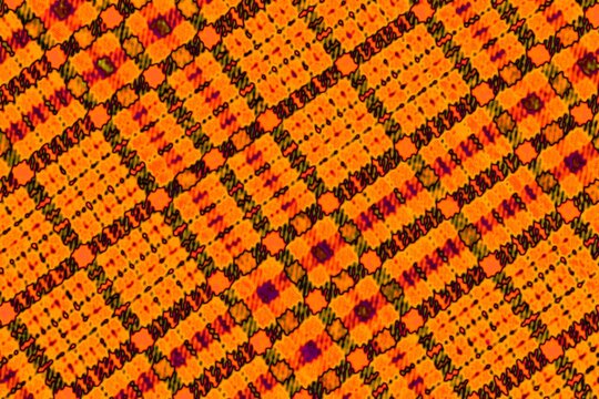 Colored dots on orange background Solarization