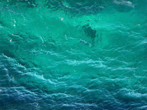 Ocean water blue turquoise waves surface background.