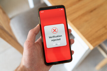 Verification rejected message on smartphone screen. Failed verification process.