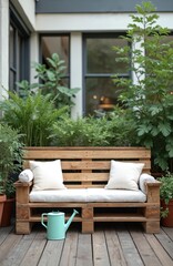 Naklejka premium Wooden pallet couch with white cushions sits on deck surrounded by green plants. Light blue watering rests near sofa. Outdoor seating area blends rustic design with modern comfort, perfect for