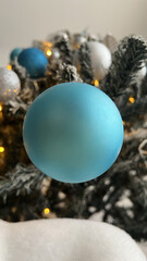 Blue Christmas Ornament ball on Tree Branch
