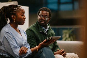 Business colleagues collaborating on digital tablet in office