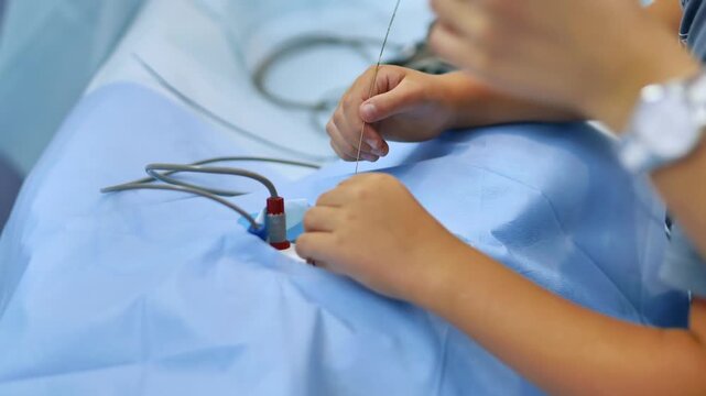 Doctor hands preparing for a medical procedure using a catheter and needle