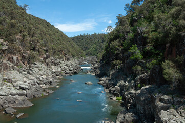 Scenic river corridor with rock formations and bushland in Cataract Gorge Reserve, suited for travel articles, mapping visuals and outdoor projects.