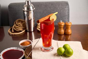 Traditional mexican cocktail, michelada, made with beer and tomato juice.