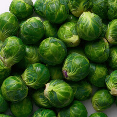 Fresh Brussels sprouts piled together, showcasing vibrant green color and tight leaves. Ideal for healthy food concepts, vegetable packaging, meal prep themes, and nutrition visuals.