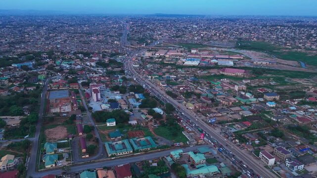 Aerial shot of Accra Ghana with the N1 highway cutting through a dense urban landscape