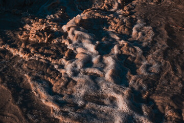turbulent stream of dirty water in the hills